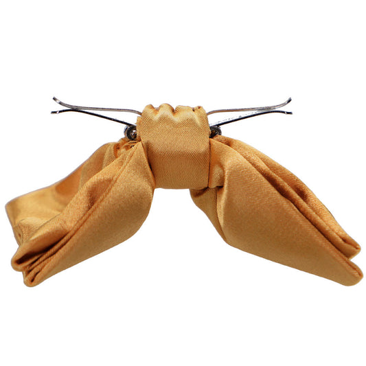 Side of of an antique gold clip-on bow tie