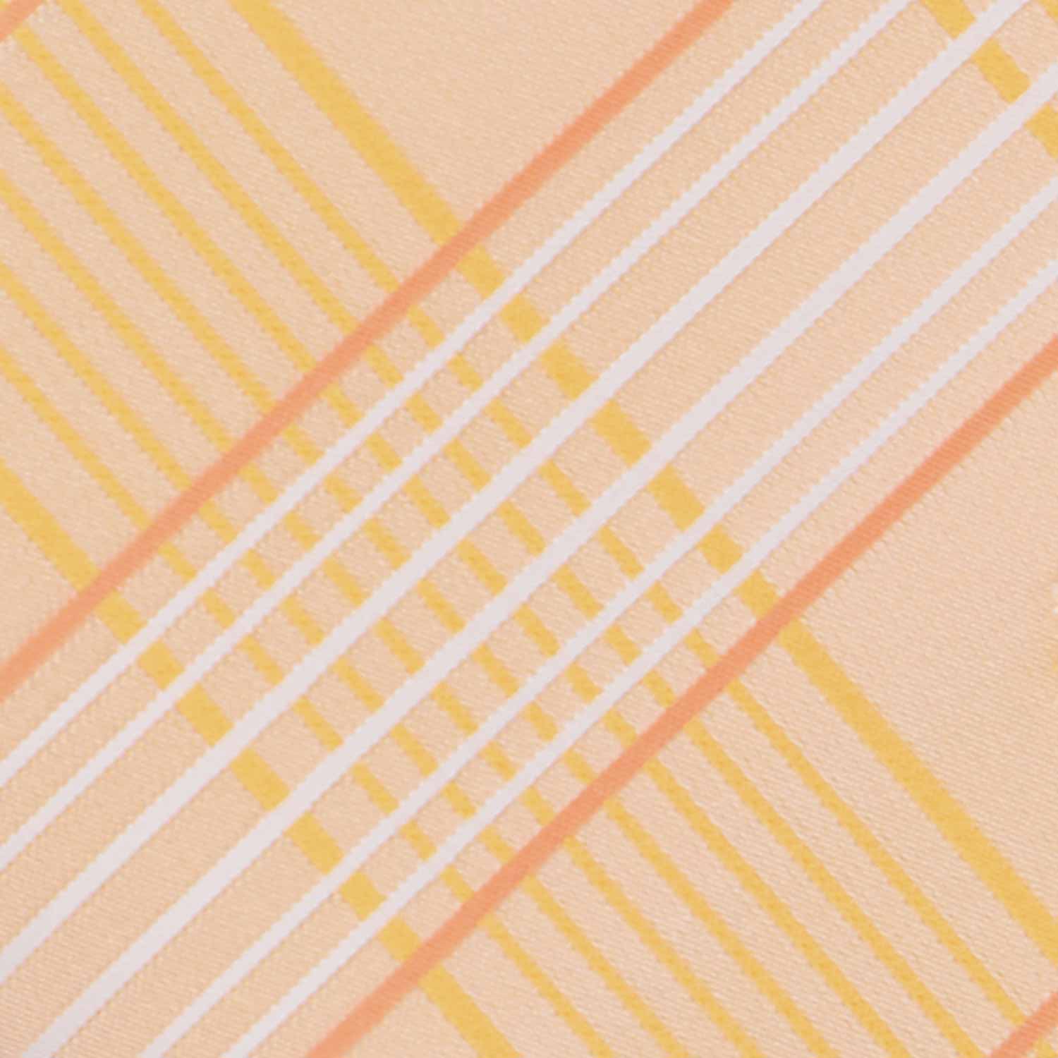 Closeup of an apricot plaid tie